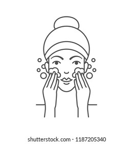 Vector illustration of woman is washing her face with cleanser