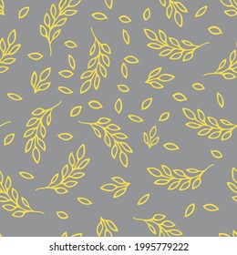 A Vector Illustration of yellow doodle leaves isolated on a gray background, Seamless pattern