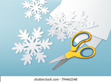 Vector illustration of yellow scissors and cut paper snowflakes with sheets of paper. Isolated on blue background