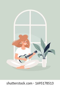 Vector illustration of young blonde woman sitting in lotus position on the floor and playing the guitar by a potted plant at home.