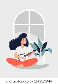 Imagen vectorial de una joven morena sentada en el suelo y tocando la guitarra en una planta maceta en casa.