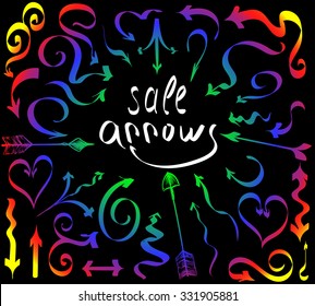 Vector illustration.Hand drawing arrows in the form of twisted ribbons. Rainbow gradient on a black background.
