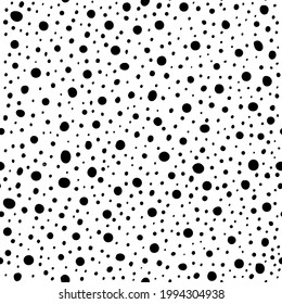 Vector illustrations of abstract hand drawn polka dots and spots seamless pattern. Good for backgrounds, textiles, fabrics, wrapping paper and wallpaper. Black and white colors.