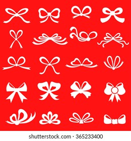 Vector illustrations of silhouette bow set on red background