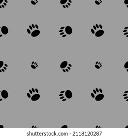 Vector image of animal footprints pattern on gray background.