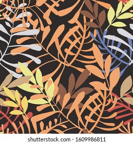 Vector image of colorful leaves and twigs in the jungle on a dark background. Seamless pattern for wallpaper, textile and wrappers.
