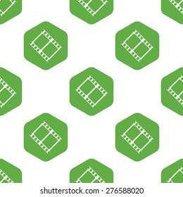 Vector image of film strip in hexagon, repeated on white background