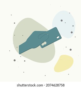 Vector image  hand holding a credit card. Credit card on multicolored background. Layers grouped for easy editing illustration. For your design.