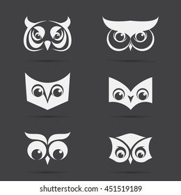 Vector image of an owl face design on black background. Vector owl face for your design.