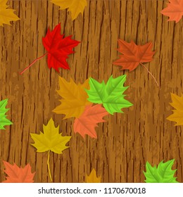 Vector image of realistic, autumn maple leaves on a wooden background