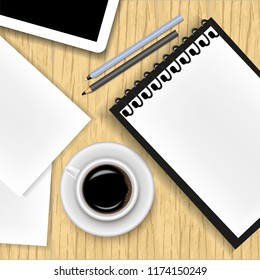 Vector image of a realistic office background. A cup of coffee, a notepad, a tablet, a pen, a pencil and a sheet of paper lying on a wooden table