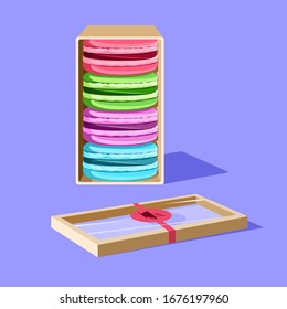 Vector image of a set of multi-colored macaroons in an open package with a transparent cover.