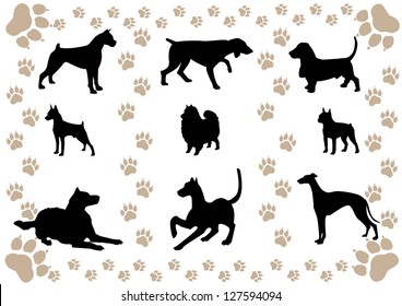 vector image of silhouettes of dogs and paw prints