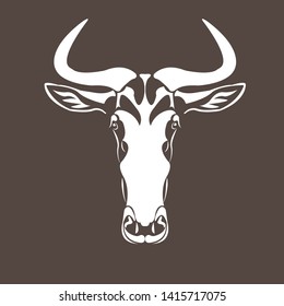 Vector image of an wildebeest head design on brown.
