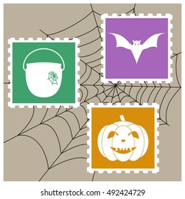 Vector imitation postage stamps with silhouettes as Halloween characters on the background of spiderweb. Bat, pumpkin, witches pot.