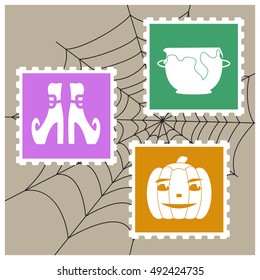 Vector imitation postage stamps with silhouettes as Halloween characters: pumpkin, witch pot and shoes on the background of spiderweb. 