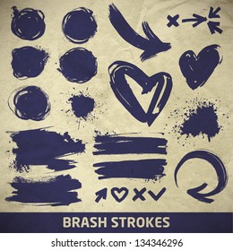 vector ink arrows, splashes and symbols set on a paper background. brush stroke