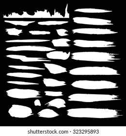 Vector ink stain Vector set of white   blots Isolated on  Black background Abstract vector background set for design use Collection of white  paint splash. Vector set of brush strokes. Ink Splat Set