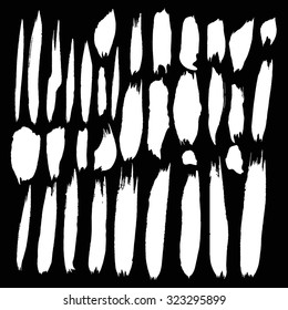 Vector ink stain Vector set of white   blots Isolated on  Black background Abstract vector background set for design use Collection of white  paint splash. Vector set of brush strokes. Ink Splat Set