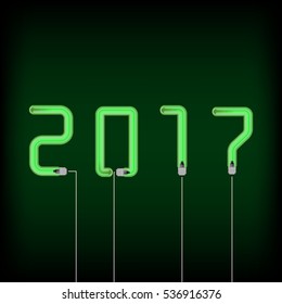 Vector inscription 2017 from green lamp on dark background