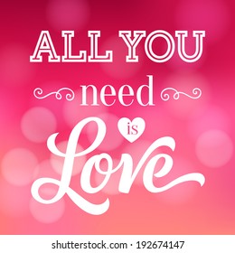 Vector inscription with ornamental elements on defocus background. "All You need is Love" poster or greeting card