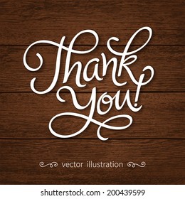 Vector inscription with ornamental elements on wood background. "Thank You!" poster or greeting card