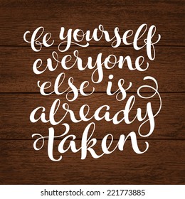 Vector inscription with ornamental elements on wood background. "Be yourself everyone else is already taken" poster or postcard. Typography collection