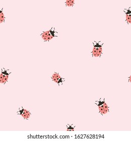 Vector insect seamless pattern. Hand-drawn ladybugs on the pink background. 