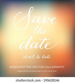 Vector invitation card with handwritten calligraphy and blurry photographic bokeh background. Save the Date