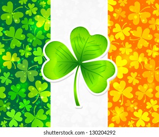 Vector Irish flag background made from green and orange clovers with big clover on it.