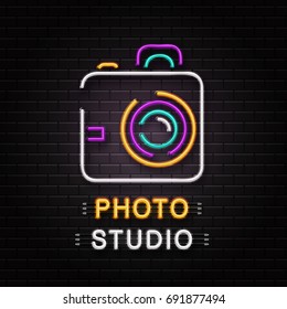 Vector isolated neon sign of camera for decoration on the wall background. Realistic neon logo for photo studio. Concept of photographer profession and creative process.