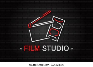 Vector isolated neon sign of cinema equipment for decoration on the wall background. Realistic neon logo for film studio. Concept of cinema, director profession and movie production.