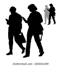 Vector isolated silhouettes of two women shopping. The woman looks into the phone, the lady gestures with her hand, talking while walking.