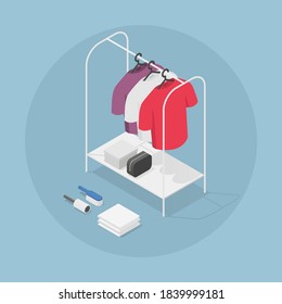 Vector Isometric Clothes Rack Illustration. T-shirts On Hangers With Shoe Box, Bag, Brush And Sticky Roller. Clothes Care Concept.