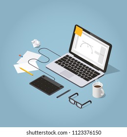 Vector isometric illustration of freelancer workspace. Laptop with graphic design software, graphics tablet with pen, papers, sketches, pencil, glasses and mug. Intensive working process concept.