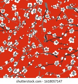 Vector Japanese sakura seamless pattern with white flowers on a red background. Background made without clipping mask