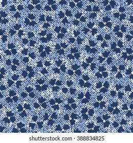 Vector Jeans background with flowers. Denim seamless pattern. Blue jeans fabric. Floral grunge background.