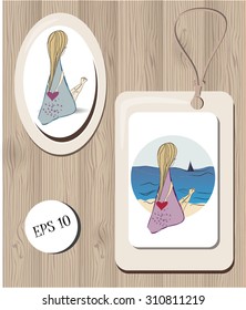 vector  keepsake set. oval example of magnet and square tag with illustration of girl looking at the sea with long blond hair and holding a heart in her hands