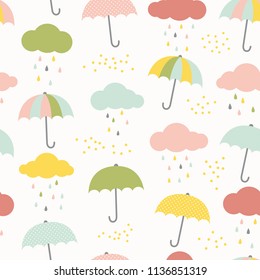 Vector kids pattern with clouds, rain drops and umbrellas. Cute colorful seamless background in blue, pink, yellow and green. 