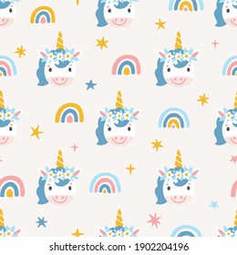 Vector kids seamless pattern with cute unicorns and rainbows. Repeated texture with smiling cartoon characters. Hand drawn magical print for fabric and wrapping paper. Childish background.