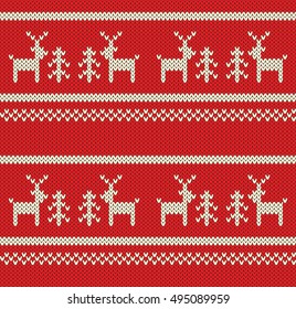 Vector knitted seamless background. Christmas motive: white deers on red background.