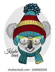 Vector koala with blue glasses, knitted hat and scarf. Hand drawn illustration of dressed koala bear.