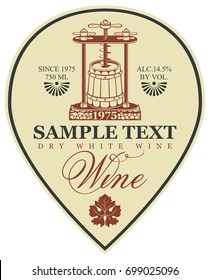 Vector label for dry white wine with a wine press and barrel in retro style with calligraphic inscription and grape leaf