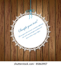 Vector lace frame on wooden background