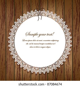 Vector lace frame on wooden background