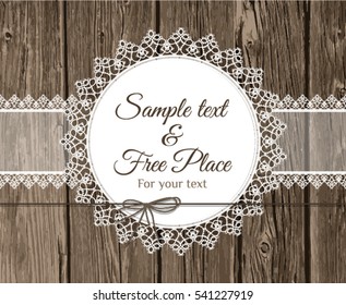 Vector lace frame with text on wooden background