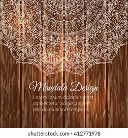 Vector lace mandala. Decor for your design, round pattern with a lot of detail on a wooden background. East style. Lace handmade.