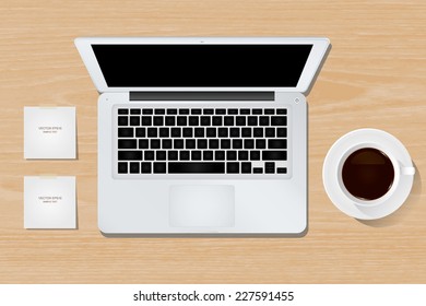 Vector laptop computer and cup of coffee on wooden background.