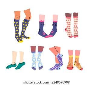 Vector legs in socks with different colorful patterns and prints doodle set. Isolated various length socks on diverse skin color human legs. Gender neutral illustration