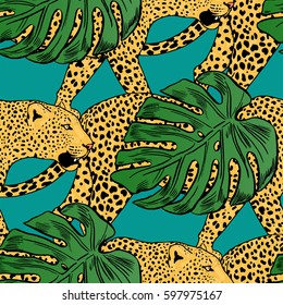 vector leopards in colorful tropical flowers seamless background.